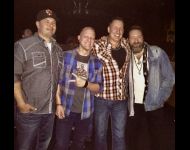 Songwriters Shane Grove, Mike Alan, David Wade, and Nolan Neal celebrate after a show where Nolan debuted their song